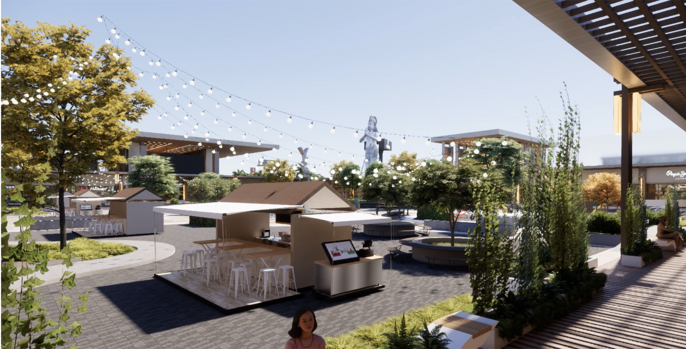 Open-air food kiosks under festoon string lights